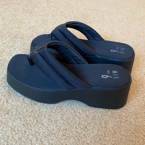 Black platform flip flops